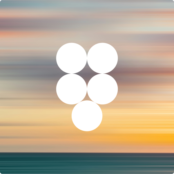 blurry photo of sunset over ocean with logo on top