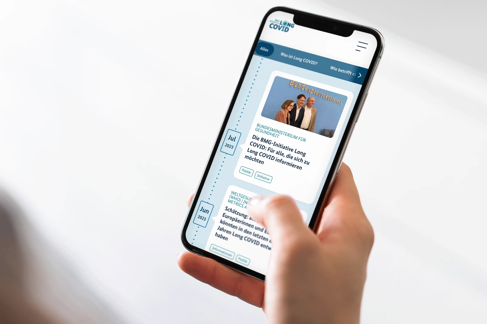 man taking a photo on a wharf